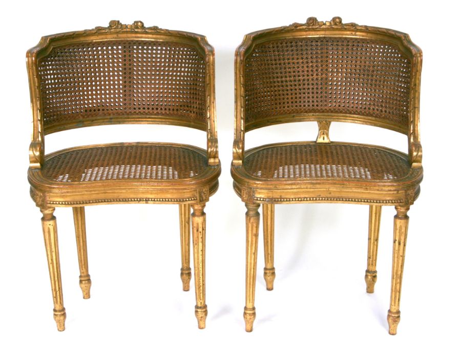 A pair of French giltwood salon chairs with double bergere backs(2).Condition Reportjoints firm,