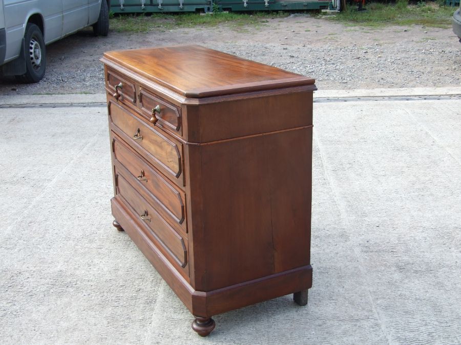 A continental walnut chest of two short and three long drawers standing on turned feet. 113cm wide - Image 3 of 3