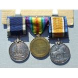 A Royal Navy Long Service Good Conduct medal, War & Victory medal named to W.J.DOWNER. STO.1. HMS.