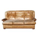 A distressed leather three-seater sofa.