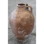 A terracotta twin-handled olive jar, 62cms high.