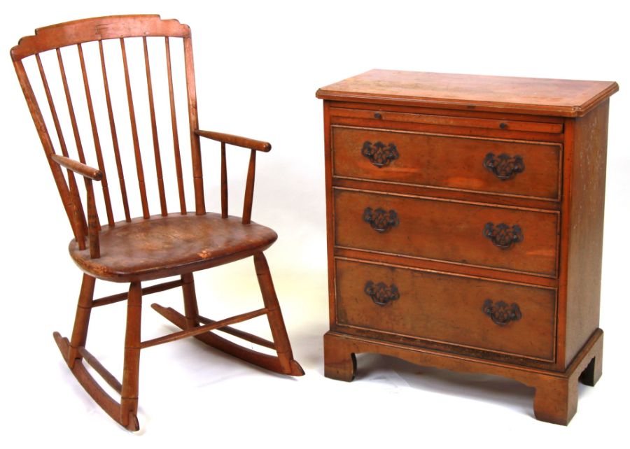 A Georgian style yew wood chest, the rectangular crossbanded top above a brushing slide with three