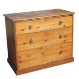 A Victorian pine chest of drawers with three long drawers, on a plinth base, 95cms wide.