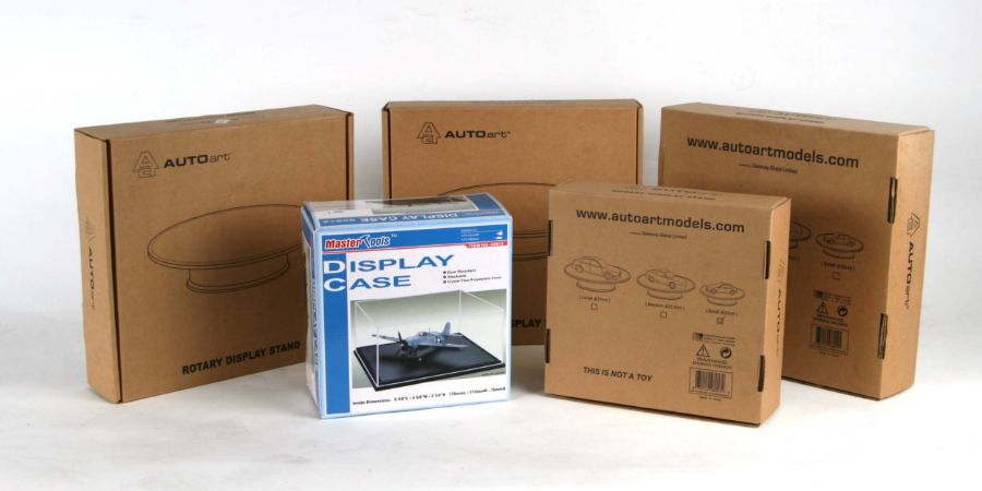 Four Auto Art rotary display stands and a Masters Tools display case, all boxed (5).