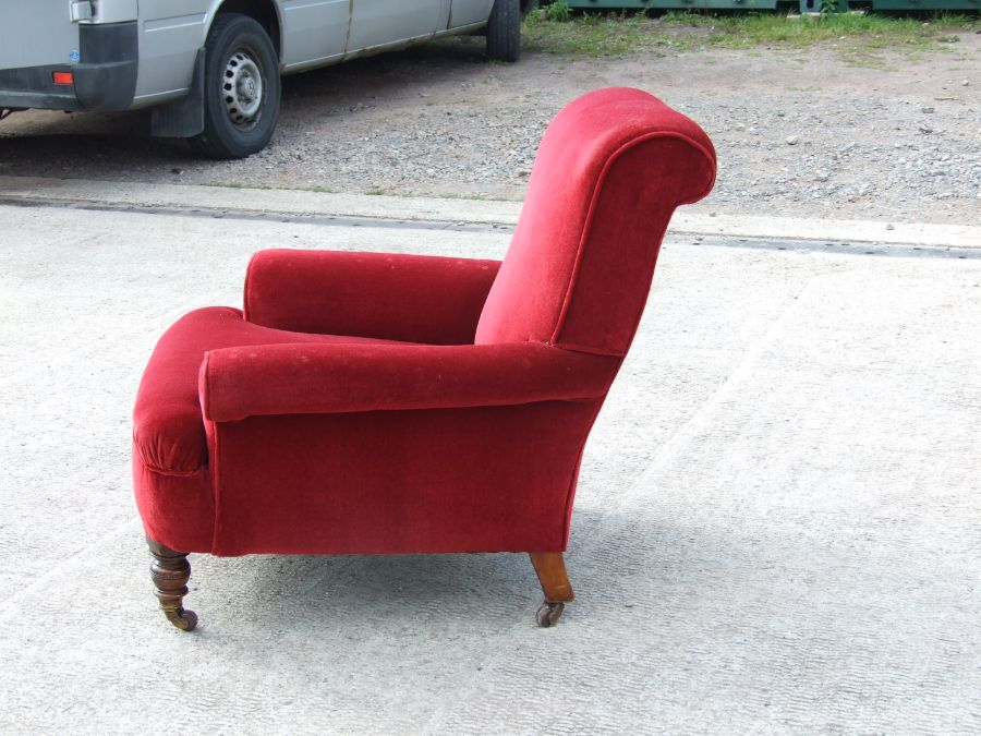 A Victorian red upholstered armchair on turned front supports.Condition Reportgood overall condition - Image 3 of 4