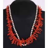 A cultured pearl necklace with 9ct gold clasp; together with a salmon coral necklace (2).
