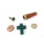 An 18ct rolled gold mounted amber cheroot holder; together with two 9ct gold front & back lockets; a