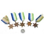 Five WWII Atlantic Star medals together with a For Loyal Service lapel badge