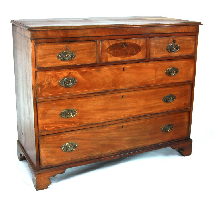 A 19th century mahogany chest of drawers with an arrangement of three short drawers above three