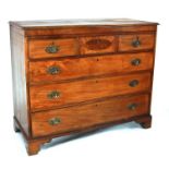 A 19th century mahogany chest of drawers with an arrangement of three short drawers above three