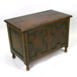 An oak blanket box decorated with geometric mouldings, 86cms wide.