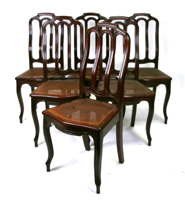 A set of six continental dining chairs with caned seats, on cabriole front supports (6).