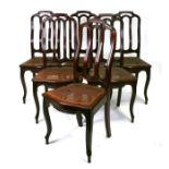 A set of six continental dining chairs with caned seats, on cabriole front supports (6).