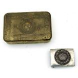 A WWI Princess Mary Xmas tin together with a German belt buckle