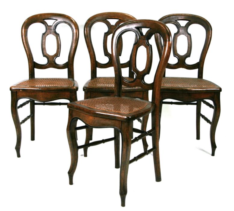 A set of four continental balloon back dining chairs with caned seats (4).