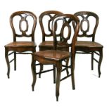 A set of four continental balloon back dining chairs with caned seats (4).