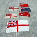 A Royal Navy White Ensign flag, 136 by 68cms; together with other flags.