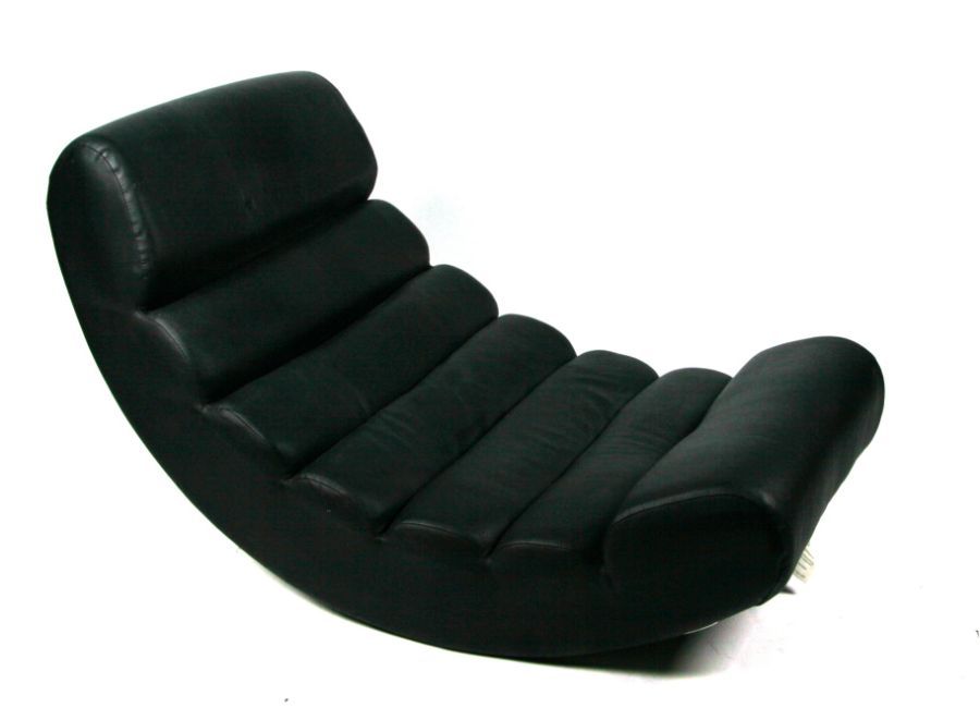 A modern design Le Corbusier inspired faux black leather pleated rocking chaise longue.