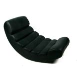 A modern design Le Corbusier inspired faux black leather pleated rocking chaise longue.
