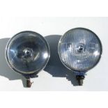 A pair of 1960's Lucas 7ins diameter spot lights with black painted bodies and chrome rims (2).