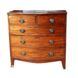 A 19th century mahogany bowfront chest of two short and three long drawers, on bracket feet,