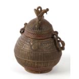 An Indian bronze pot & cover, 11.5cms high.