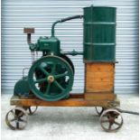 A Lister Model L single cylinder stationary engine, model no. 5196, mounted on a wooden trailer with