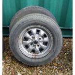 A pair of Ford Escort Mk1 14ins steel wheels with tyres (2).