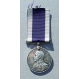 A Royal Navy Long Service Good Conduct Medal named to J.59057. A.E.SMITH. OFF STW.2CL. HMS. DELHI.
