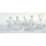 A quantity of cut glass decanters, claret jugs and other glassware.