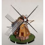 Part of the Gordon Woodham collection, a scratch built wooden windmill with revolving sails