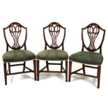 Three mahogany dining chairs with pierced back splats and upholstered seats, on square tapering