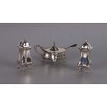 A silver three-piece cruet set of waisted form, on pad feet, Birmingham 1920, weight 228g.