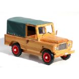 Part of the Gordon Woodham collection, a scratch built wooden V8 Land Rover. Overall length 51cms (