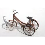 Part of the Gordon Woodham collection, a scratch built tricycle made from copper tubing, chain