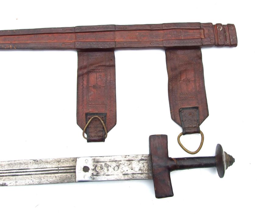 A North African sword in a tooled leather scabbard, 89cms long. - Image 3 of 7