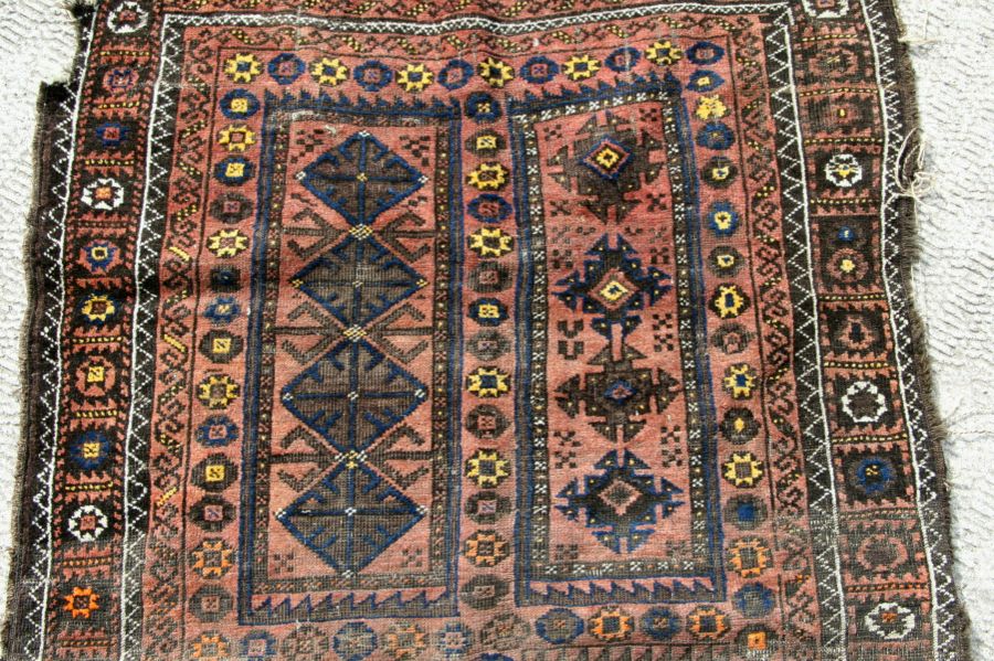 A Caucasian Shirvan rug with repeated geometric pattern on a brown ground, 102 by 170cms. - Image 5 of 10