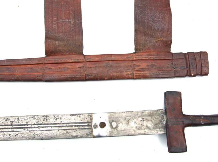 A North African sword in a tooled leather scabbard, 89cms long. - Image 6 of 7