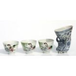 Three Chinese Republic style tea bowls decorated with a seated figure and calligraphy, 7.5cms