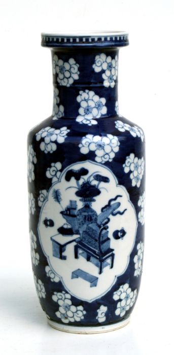 A Chinese blue & white rouleau vase decorated with birds and precious objects within panels, on a