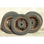 A set of five pre WWII Wolsely Hornet 19inch diameter wire wheels and tyres requiring restoration (