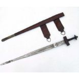 A North African sword in a tooled leather scabbard, 89cms long.