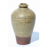 A Chinese proto Yue ware vase with incised decoration, 16cms high.