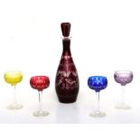 A Bohemian ruby flashed glass decanter; together with four coloured cut glass hock glasses (5).