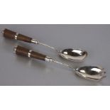 A pair of Victorian silver salad servers, Birmingham 1881, 28cms long (2).