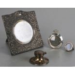 An Edwardian silver photo frame, Birmingham 1902; together with two miniature silver photo frames