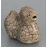A Chinese cracle glaze water dropper in the form of a stylised duck, 7.5cms long.