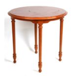 A modern circular coffee table on turned legs, 70cms diameter.