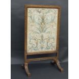 A William Morris silk embroidered panel, framed & mounted in a giltwood fire screen, the panel 49 by