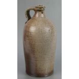 A Tim Hurn wood fired salt glazed stoneware bottle, 31cms high.
